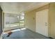 Enclosed patio with door to home and view of yard at 3262 Montclair Cir, North Port, FL 34287