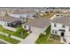 Aerial view of a well-kept single Gathering home featuring green lawn, landscaping and an attached garage at 33581 Elm Hill Br, Wesley Chapel, FL 33545