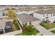 An aerial view of a single-Gathering home with a screened enclosure and a lake view at 33581 Elm Hill Br, Wesley Chapel, FL 33545