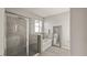 Bathroom featuring a glass-enclosed shower and separate tub, offering a spa-like experience in a modern setting at 33581 Elm Hill Br, Wesley Chapel, FL 33545