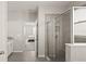 Modern bathroom showcasing a glass-enclosed shower and tiled floors, providing a clean and stylish space at 33581 Elm Hill Br, Wesley Chapel, FL 33545