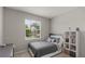 Cozy bedroom with natural light from the window, offering a comfortable and serene retreat at 33581 Elm Hill Br, Wesley Chapel, FL 33545