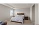 This primary bedroom features neutral walls, a tray ceiling, and a cozy, inviting atmosphere at 33581 Elm Hill Br, Wesley Chapel, FL 33545
