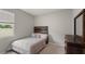 Comfortable bedroom with warm wood accents and plenty of natural light, perfect for relaxing at 33581 Elm Hill Br, Wesley Chapel, FL 33545