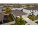 An aerial view shows this beautiful home with a screened-in pool, fenced yard and a picturesque pond in the neighborhood at 33581 Elm Hill Br, Wesley Chapel, FL 33545