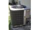View of the home's Carrier air conditioning unit in good condition on the side of the house at 3586 Culpepper Ter, North Port, FL 34286