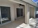 Outdoor back porch featuring sliding glass doors, providing seamless indoor-outdoor living at 3586 Culpepper Ter, North Port, FL 34286