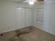 Bedroom with a closet, carpet, ceiling fan, and a window at 3586 Culpepper Ter, North Port, FL 34286