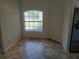 Bright dining area featuring tile floors and a large arched window at 3586 Culpepper Ter, North Port, FL 34286