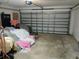 Spacious garage with metal doors and ample storage space at 3586 Culpepper Ter, North Port, FL 34286