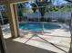 View from the lanai onto the screened-in pool, offering a seamless indoor-outdoor living experience at 3586 Culpepper Ter, North Port, FL 34286