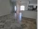Spacious living room featuring stylish tile flooring, natural light, and an open layout at 3586 Culpepper Ter, North Port, FL 34286