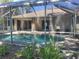 Inviting screened-in pool area, perfect for relaxation and entertaining, with easy access to the home at 3586 Culpepper Ter, North Port, FL 34286