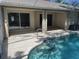 Relaxing backyard pool features screened-in enclosure and convenient access from the home at 3586 Culpepper Ter, North Port, FL 34286