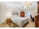 Cozy bedroom offering natural light and a ceiling fan at 37434 Derbyshire Dr, Zephyrhills, FL 33542