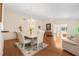 Inviting dining room featuring a chandelier, hardwood floors, and open-concept floor plan at 37434 Derbyshire Dr, Zephyrhills, FL 33542