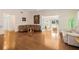 Bright living room with hardwood floors and neutral walls for flexible personalization at 37434 Derbyshire Dr, Zephyrhills, FL 33542