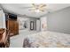 Large main bedroom offers lots of room, carpeted floor, ceiling fan, and walk-in closet at 37434 Derbyshire Dr, Zephyrhills, FL 33542