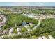 Aerial view of homes in a well-established neighborhood, near a pond, backing onto a nature preserve at 4111 70Th E Ave, Ellenton, FL 34222