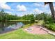 Picturesque backyard with a fire pit and stunning waterfront views at 4111 70Th E Ave, Ellenton, FL 34222