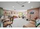 Spacious bonus room with a bar, comfortable seating, and room for entertainment at 4111 70Th E Ave, Ellenton, FL 34222