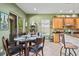 Bright breakfast nook adjacent to kitchen with sliding glass door to outdoor space at 4111 70Th E Ave, Ellenton, FL 34222