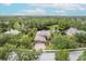 Beautiful home surrounded by lush greenery and a serene pond, offering privacy and a scenic view at 4111 70Th E Ave, Ellenton, FL 34222