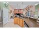 Modern kitchen featuring granite countertops, stainless appliances, and an open design at 4111 70Th E Ave, Ellenton, FL 34222