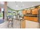 Gourmet kitchen with granite countertops and center island with bar stool seating at 4111 70Th E Ave, Ellenton, FL 34222
