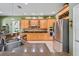 Well-equipped kitchen with custom cabinetry, stainless steel appliances, and modern fixtures at 4111 70Th E Ave, Ellenton, FL 34222