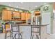 Spacious kitchen featuring custom cabinets, stainless steel appliances, and a tiled backsplash at 4111 70Th E Ave, Ellenton, FL 34222