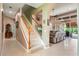 Hallway featuring a staircase, seamlessly connecting to the dining and living space at 4111 70Th E Ave, Ellenton, FL 34222