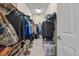 Walk-in closet that provides ample storage and organization space with racks and shelving at 4111 70Th E Ave, Ellenton, FL 34222