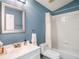 Bathroom showcasing a standard sink, toilet, and a shower with a white shower curtain at 4206 Morning Breeze Ct, Tampa, FL 33619