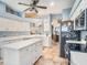 Contemporary kitchen featuring white cabinets, stainless steel appliances, and an island that enhances functionality at 4206 Morning Breeze Ct, Tampa, FL 33619