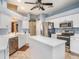 Open kitchen featuring white cabinets, stainless steel appliances, and a central island for efficient meal preparation at 4206 Morning Breeze Ct, Tampa, FL 33619