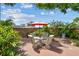 Charming backyard patio with outdoor seating and lush landscaping offering privacy at 4462 2Nd S Ave, St Petersburg, FL 33711