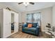 Bright bedroom with a mirrored wardrobe, accent furniture, and a colorful patterned curtain at 4462 2Nd S Ave, St Petersburg, FL 33711