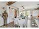 Dining room showcases farmhouse style decor and table setting, with a sliding barn door at 4462 2Nd S Ave, St Petersburg, FL 33711