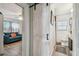 Hallway between living room and bathroom featuring shiplap and decorative barn door at 4462 2Nd S Ave, St Petersburg, FL 33711