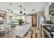 Bright kitchen with a kitchen island, modern appliances, and open layout to dining area at 4462 2Nd S Ave, St Petersburg, FL 33711