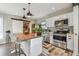 Well-appointed kitchen with stainless steel appliances, white cabinets, and wood countertop island at 4462 2Nd S Ave, St Petersburg, FL 33711