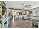Bright, open-concept living room showcasing elegant flooring and ceiling fans and stylish decor at 4462 2Nd S Ave, St Petersburg, FL 33711