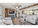Inviting living room features modern decor, hardwood floors, and wood accent wall with television at 4462 2Nd S Ave, St Petersburg, FL 33711