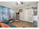 Inviting living room with comfortable blue seating and a sliding barn door entrance at 4462 2Nd S Ave, St Petersburg, FL 33711