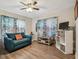 Comfortable living room with hardwood floors, bright decor, and ample seating at 4462 2Nd S Ave, St Petersburg, FL 33711