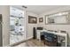 Office area showcases a well-lit workspace with a view to an adjacent kitchen and living area at 4462 2Nd S Ave, St Petersburg, FL 33711