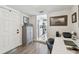Office area leading into the kitchen, featuring hardwood floors and modern desk at 4462 2Nd S Ave, St Petersburg, FL 33711