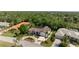 Aerial view of a home featuring a tile roof, well-manicured landscaping, and a circular driveway at 4677 Del Sol Blvd, Sarasota, FL 34243