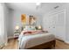 Charming bedroom with neutral colors, stylish decor, and wood flooring at 4677 Del Sol Blvd, Sarasota, FL 34243